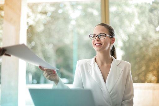 Woman handing over paperwork